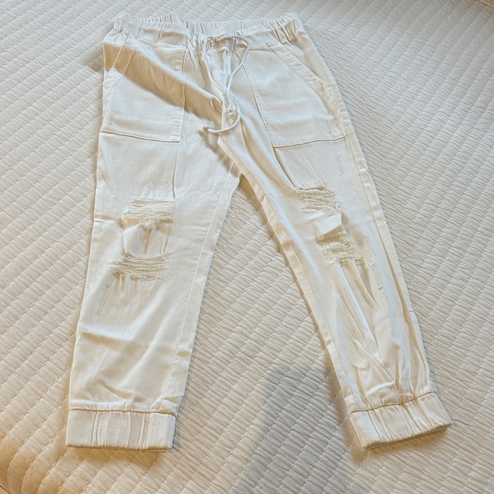 Boutique distressed, elastic drawstring, cinched bottom pant